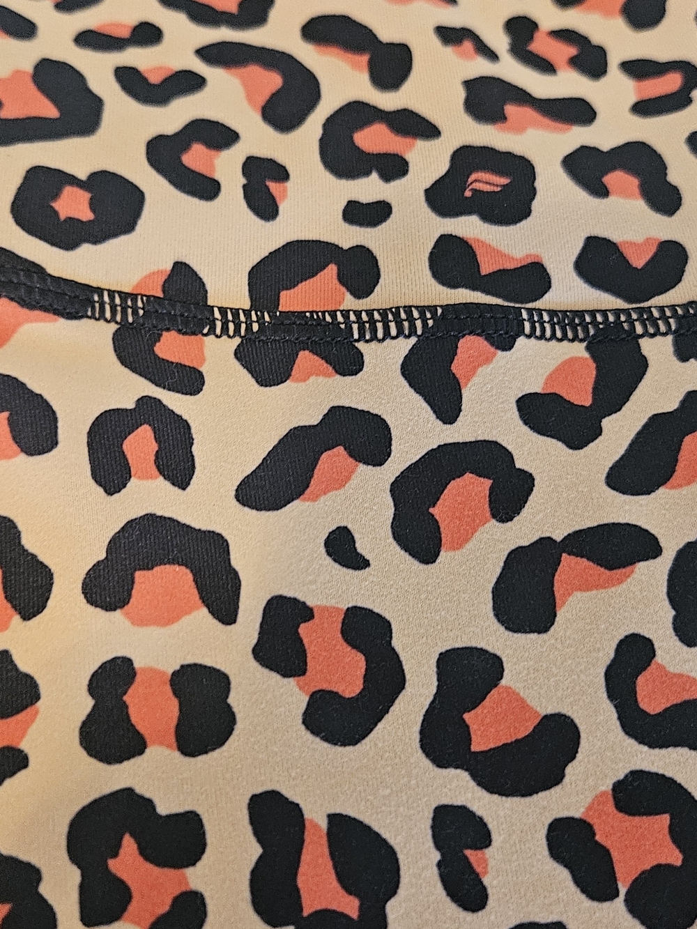 Fabletics PowerHold Leopard Print Leggings in Cream, Black & Orange - Picture 2 of 8